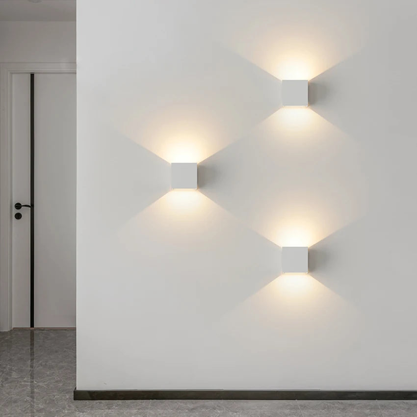 Modern decorative lamp trio showcasing elegant wall-mounted design with warm ambient lighting.