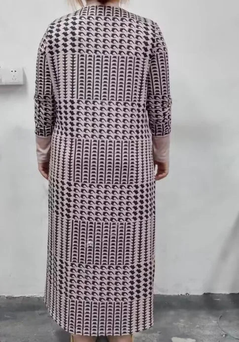 Back view of a patterned longline cardigan featuring black and white prints, ideal for casual autumn wear.