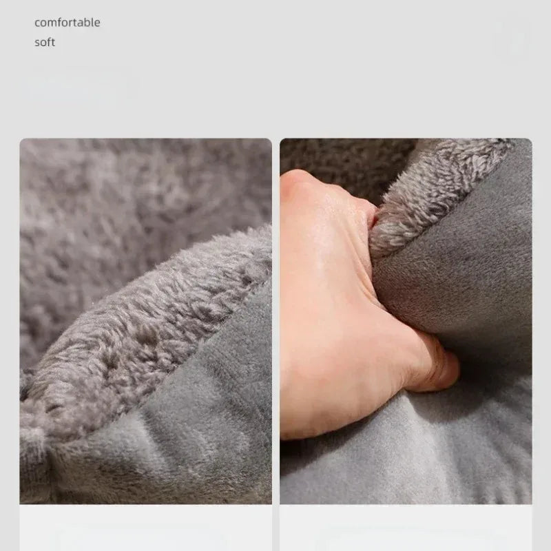 Close-up of a soft, gray pet bed mat being pressed to show its plush, comfortable texture for pets.
